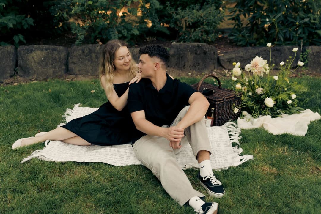 Daniel and Amy on a picnic blanket